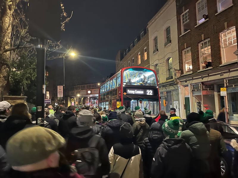 London commuters in their marooned red buses were utterly bemused at the sight of an enormous flow of Dubliners in green bobble hats