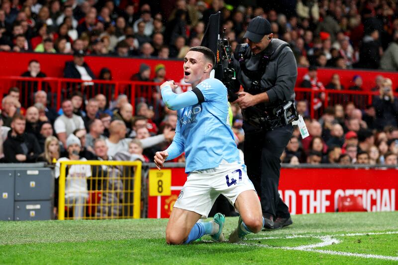 Phil Foden of Manchester City celebrates after scoring the team's third goal. Photograph: Catherine Ivill/Getty