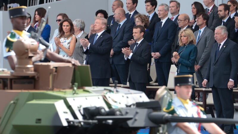 President  Trump at the  Bastille Day military parade on the Champs-Elysees avenue in Paris last July. According to reports, he enthused about the display of military pomp and ceremony on his way back to the US on Air Force One. Photograph: Getty Images