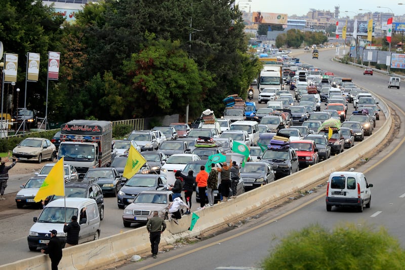 People sit in traffic as they return to their villages after a ceasefire between Israel and Hezbollah went into effect in Ghazieh, Lebanon. Photograph: Mohammed Zaatari/AP