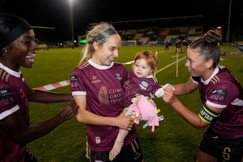 Julie-Ann Russell and Rosie, with Rola Olusola and Jenna Slattery, at Shamrock Rovers v Galway United match in the Avenir Sports All-Island Cup Final, Tallaght Stadium. Photograph: James Lawlor/INPHO