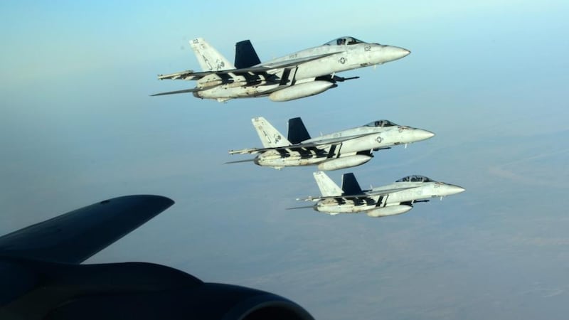 A formation of US navy F-18E Super Hornets leaving after receiving fuel from a KC-135 Stratotanker over northern Iraq, on September 23rd.  EPA/DOD/US AIR FORCE/Sgt Shawn Nickel