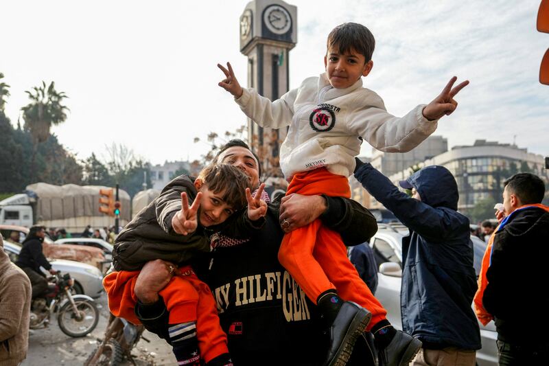 Syrians celebrate in the central city of Homs, after rebel forces entered Syria's third city overnight. Islamist-led rebels declared they had taken Damascus in a lightning offensive on December 8th. Photograph: Muhammad Haj Kadour/AFP via Getty Images