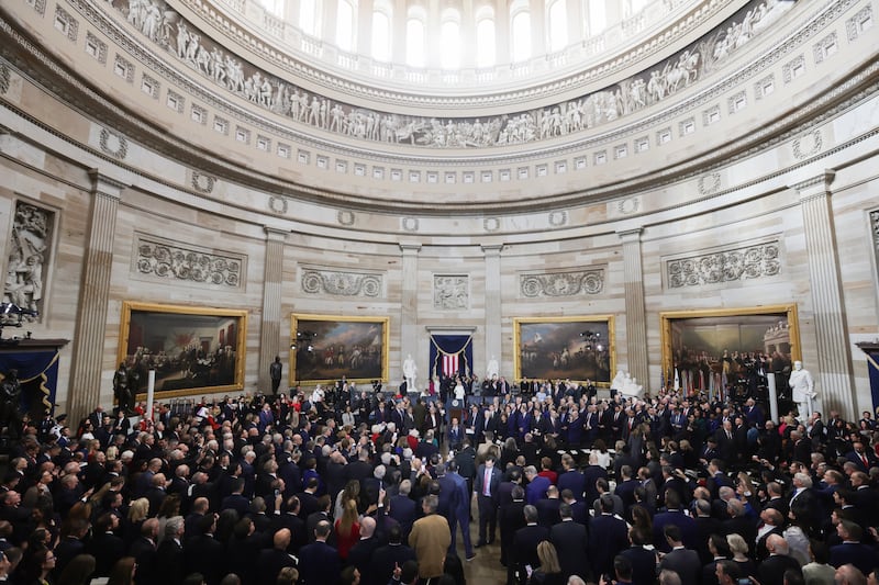 People arrive for the inauguration of US President-elect Donald Trump in the U.S. Capitol Rotunda. Photo by Fabrizio Bensch-Pool/Getty Images