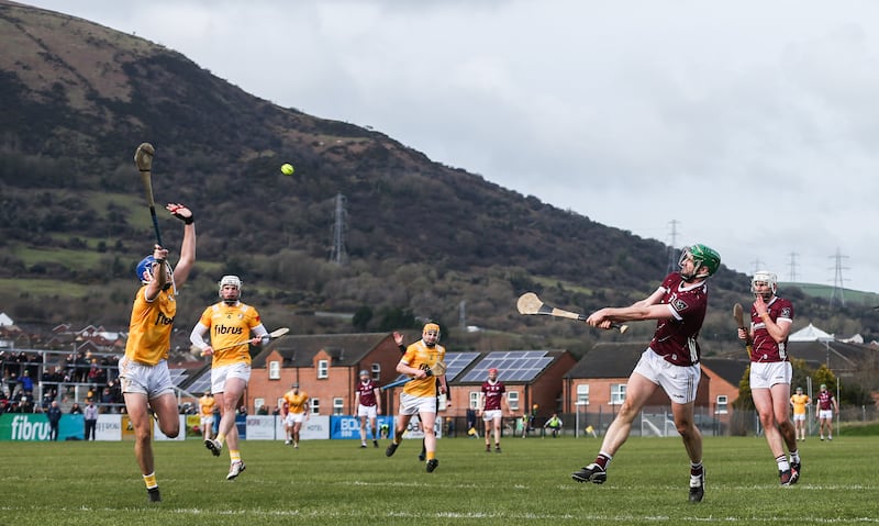 Burke takes a shot past Scott Walsh of Antrim during an Allianz Hurling League Division 1B clash at Corrigan Park in Belfast in February last year. Photograph: Tom Maher/Inpho