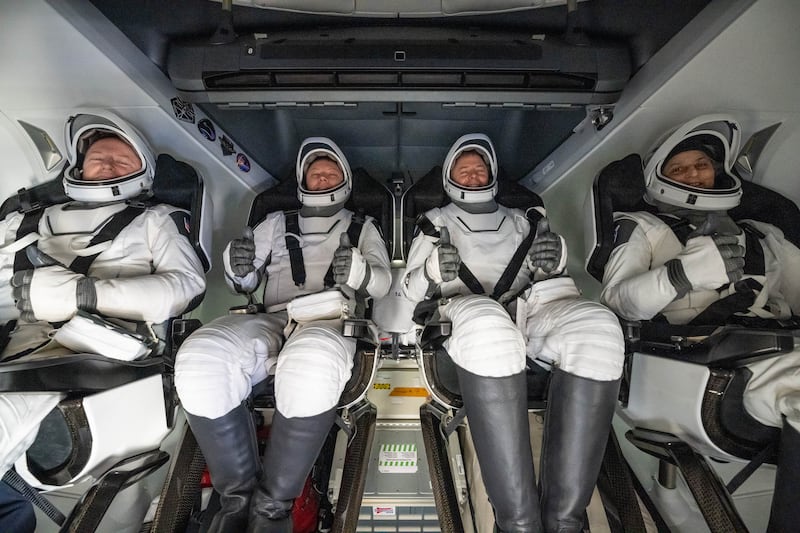 Nasa astronaut Butch Wilmore (left), Roscosmos cosmonaut Aleksandr Gorbunov (second from left), and Nasa astronauts Nick Hague (second from right) and Suni Williams (right) are seen inside a SpaceX Dragon spacecraft onboard the SpaceX recovery ship Megan. Photograph: Keegan Barber/Nasa via Getty Images