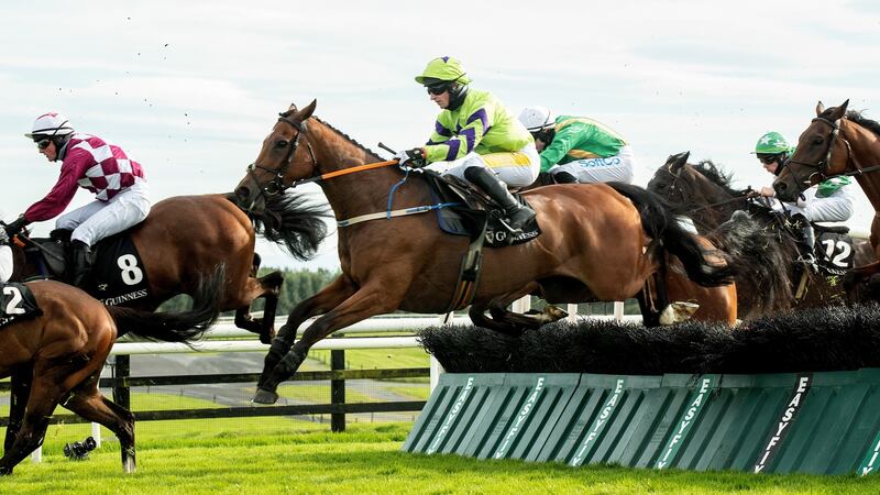 Denis Hogan  donned silks for the final time and rode Bua Boy to win the  handicap hurdle. Photograph: James Crombie/Inpho