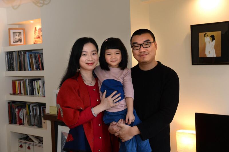 Shimeng Zhou with her husband Dong Wang and their four-year-old daughter Shinyee, at home in Crumlin, Dublin Photograph: Dara Mac Dónaill/The Irish Times