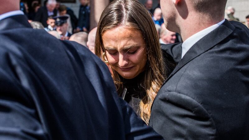 Niamh Lacey grieves at the loss of her uncle Anton O’Toole at the Mount Argus church in Dublin. Photograph: James Forde