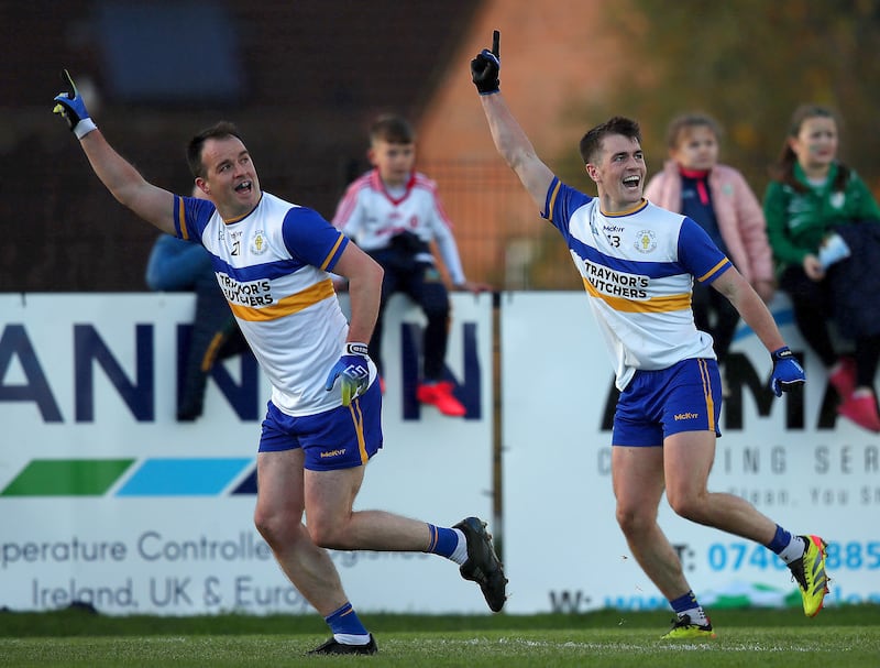 Errigal Ciarán's Dermot Morrow celebrates scoring a point with Ruairí Canavan. Photograph: Leah Scholes/Inpho
