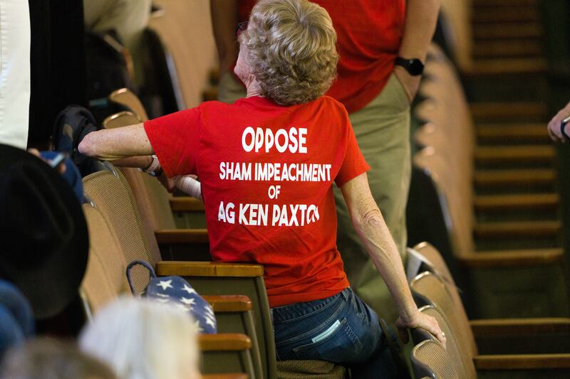 Those in the red shirts at the Senate building, consider it a witch hunt. Photograph: Jordan Vonderhaar/The New York Times
                      