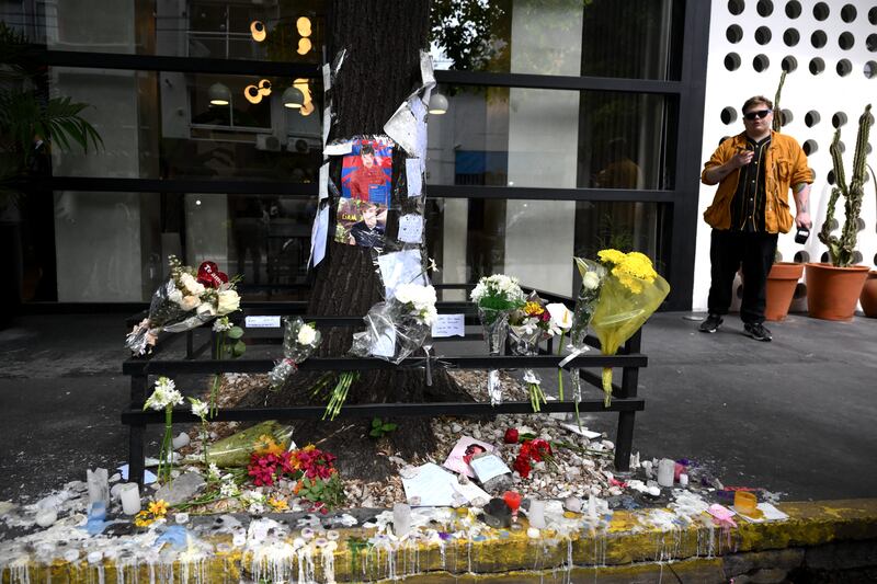 Tributes left to Payne in front of the hotel in Buenos Aires where he died. Photograph: Luis Robayo/AFP via Getty