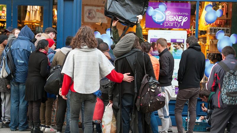 Homeless men and women queuing for free pizza on Grafton St, distributed by the Sunday Pizza Club. Photograph: Dave Meehan