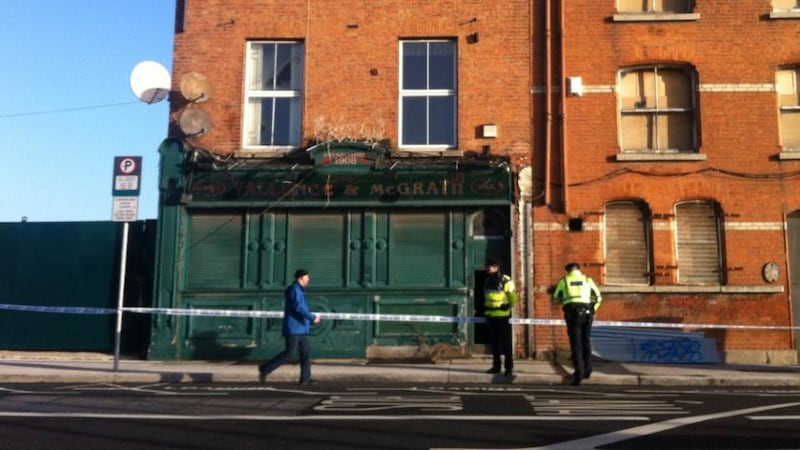 Gardai outside a former pub in north Dublin where a man a was fatally stabbed last night. Photograph: Sorcha Pollak