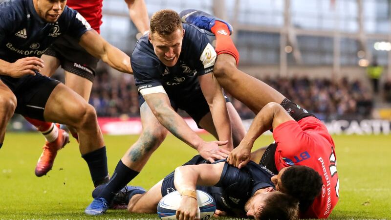 Leinster outhalf Ross Byrne scores a try during the Heineken Champions Cup quarter-final at the  Aviva Stadium. Photograph: Billy Stickland/Inpho