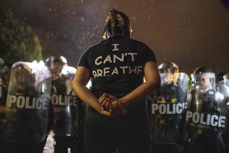 Killing of George Floyd: a protester and police face off outside the White House. Photograph: Eric Baradat/AFP via Getty