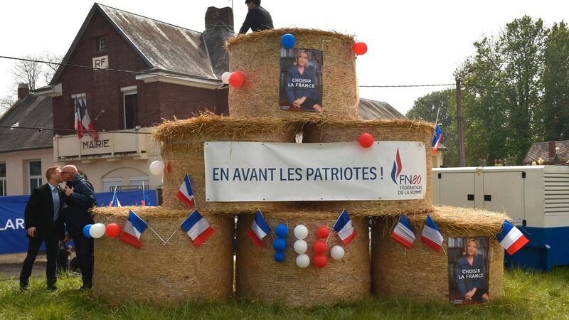 The banner under the photograph of Marine Le Pen in Ennemain reads, ‘Forward the Patriots’.