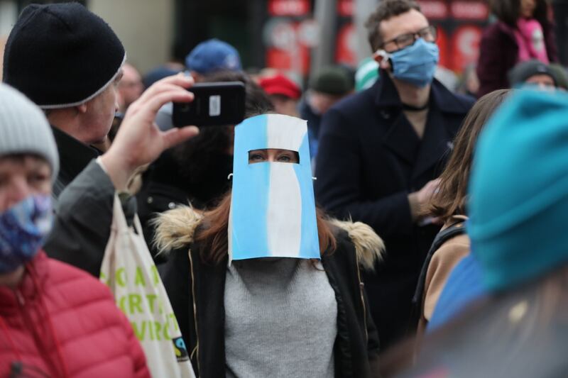 A woman takes part in the protest. Photograph: Niall Carson/PA Wire