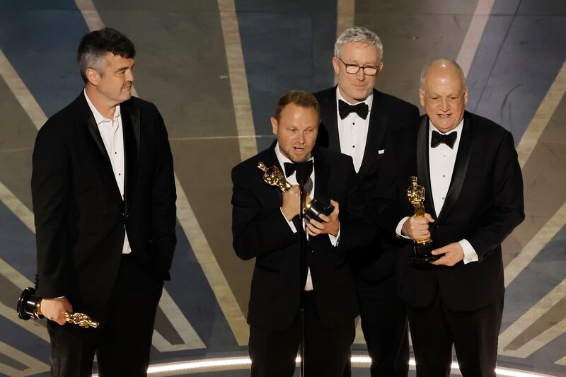 Richard Baneham, an alumnus of Ballyfermot College in Dublin, accepts his Oscar statuette for Best Visual Effects on Avatar: The Way of Water, at the 95th Annual Academy Awards. Photograph: Kevin Winter/Getty Images