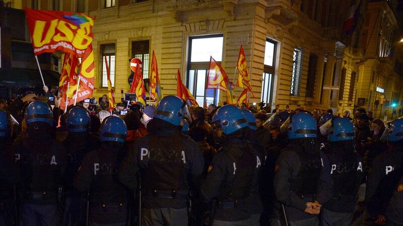 Police  watch as supporters of a “No” vote in  the constitutional referendum in Italy rally   after the end of the vote in Rome. Photograph: Filippo Monteforte/AFP/Getty Images