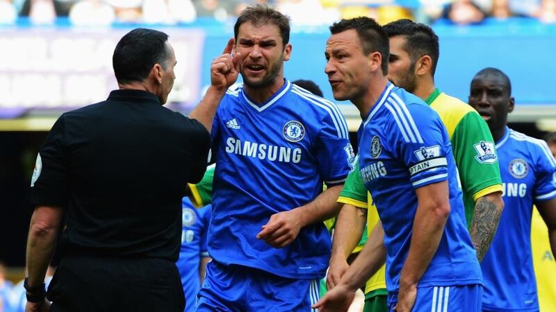 Branislav Ivanovic (centre)John Terry    of Chelsea react as  referee Neil Swarbrick turns down a penalty appeal during the  Premier League game against Norwich City at Stamford Bridge. Photograph:  Michael Regan/Getty Images