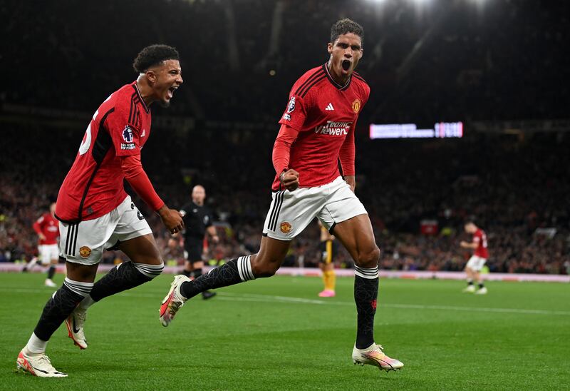 Manchester United's Raphael Varane celebrates with Jadon Sancho after scoring the team's first goal against Wolverhampton Wanderers at Old Trafford on August 14th. Photograph: Gareth Copley/Getty Images