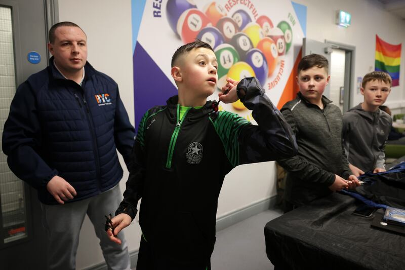 Coby Graydon enjoying a game of darts at the Belvedere Youth Club in north Dublin. Photograph: Chris Maddaloni