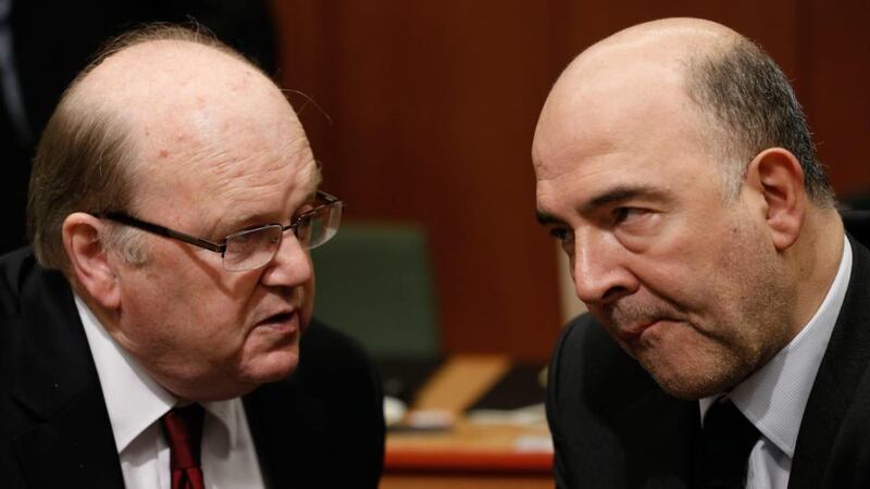 Minister for Finance Minister Michael Noonan  and EU Commissioner in charge of Economic and Financial Affairs, Taxation and Customs Union, Pierre Moscovici  at the start of the Eurogroup meeting of Finance ministers at the EU council headquarters, in Brussels, Belgium on Monday. Photograph: EPA