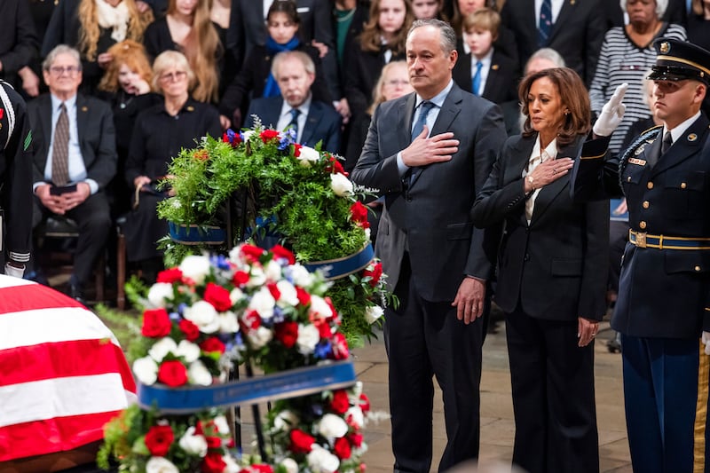 US vice president Kamala Harris and first gentleman Doug Emhoff  pay their respects at the casket of former president Jimmy Carter in the Rotunda of the US Capitol, in Washington, DC. Photograph: Jim Lo Scalzo/Pool