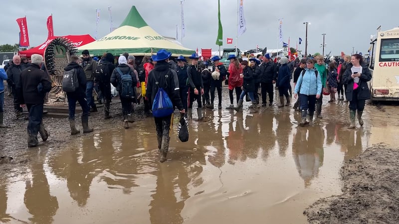 People walking through large puddles on the site on Tuesday. Photograph: Niall Carson/PA Wire 