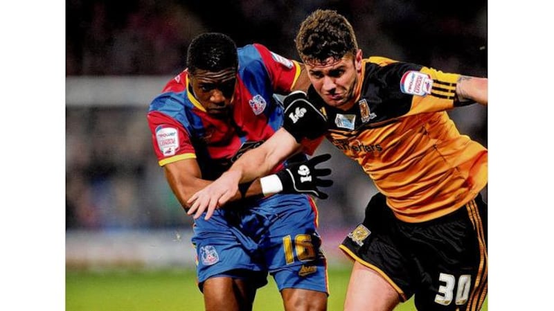 Hull City's Robbie Brady battles Wilfred Zaha of Crystal Palace during Tuesday night's Championship match. Coach Steve Bruce said it was "of paramount importance" Brady was signed by the club.photograph: getty images