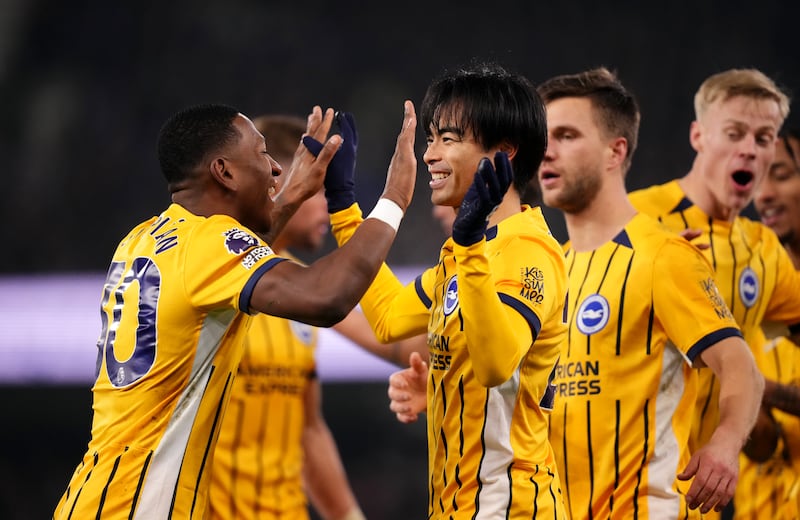 Brighton's Kaoru Mitoma (centre) celebrates with Pervis Estupinan after scoring the opening goal against Ipswich. Photograph: John Walton/PA