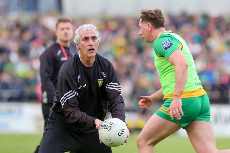 Donegal manager Jim McGuinness busily instructing the drills during his team's warm-up for the game against Tyrone in Ballybofey. Photograph: Lorcan Doherty/Inpho 