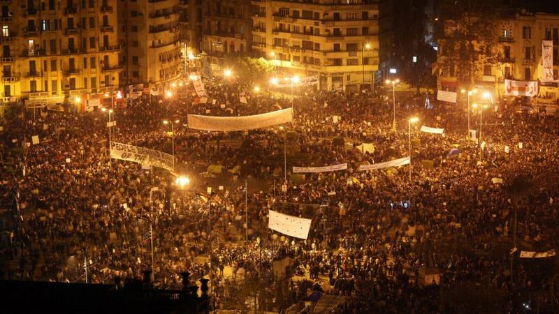 Tahrir Square, Cairo in February 2011: “The divergent steps taken by the young revolutionaries fighting for ‘bread, freedom and social justice’ in Tahrir and the morning routine of the old man pushing his large cart while delivering bread along my street was intriguing. They shared a city in tumult, but their daily steps seemed to fall along very different routes.  In those evenings I found myself repeatedly drawn towards Thomas Kinsella’s poetry, particularly his long 1978 elegy for his father, The Messenger, and an earlier poem from the 1960s, Dick King, with its focus on a neighbour from his Inchicore childhood.” Photograph: Peter Macdiarmid/Getty Images