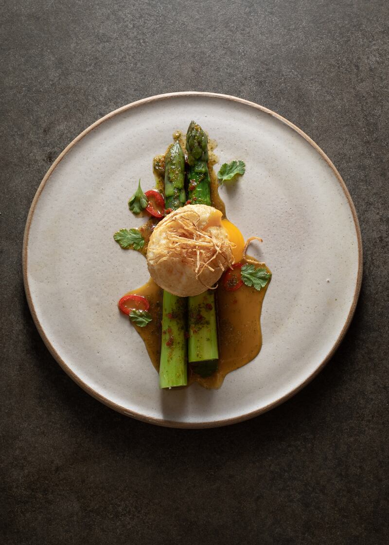 Asparagus, deep-fried egg, coriander, chilli, lime, crisped shallots. Photograph: Ruth Calder-Potts