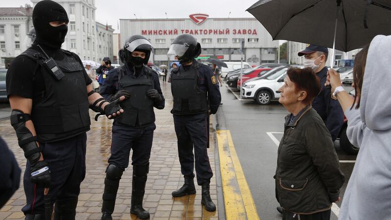 Belarus riot policemen stand in front of the Minsk Tractor Plant to prevent any rally or attempt to organize a strike in Minsk, Belarus on Wednesday. Photograph: Tatyana Zenkovich/EPA