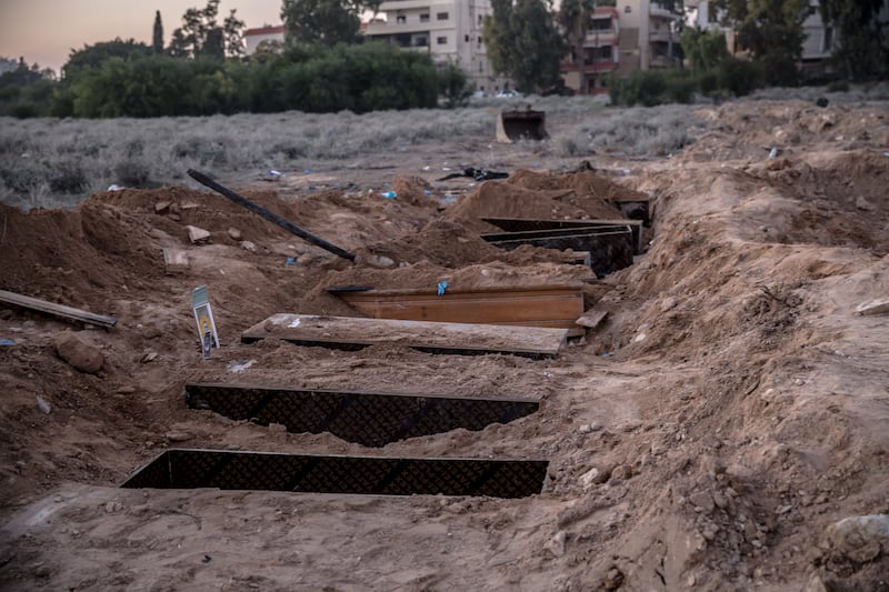 Temporary graves in Tyre were exhumed by families returning to bury their dead. Photograph: Sally Hayden