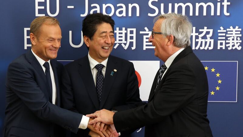 Japan’s Prime minister Shinzo Abe with European Council president Donald Tusk (left) and EU Commission president Jean-Claude Juncker. Photograph: EPA