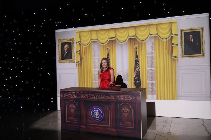 An attendee takes a photo with an Oval Office set during the Liberty Ball. Photograph: Kirsten Luce/The New York Times
                      