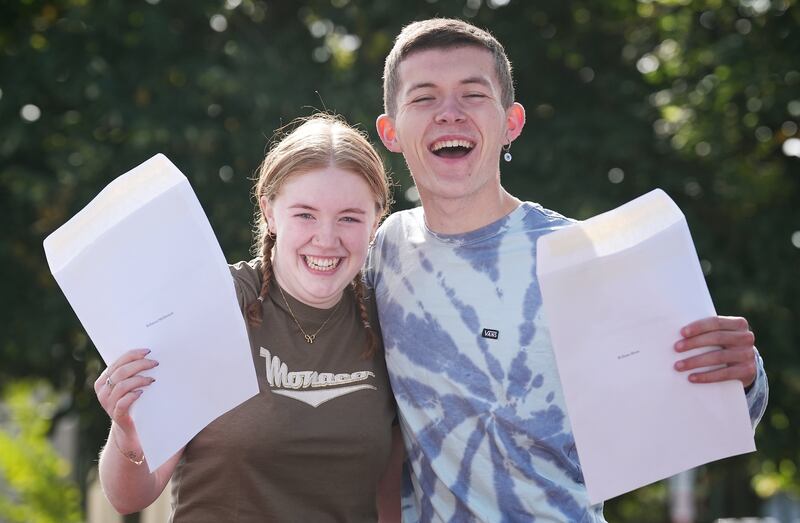 William Boon (right) and Rebecca McDermott celebrate after collecting their Leaving Certificate results at Donahies Community School, Dublin. Photograph: Brian Lawless/PA Wire