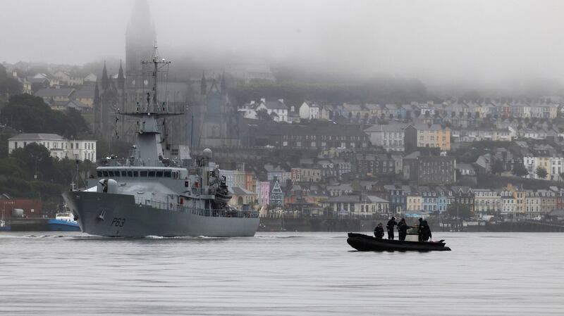 LÉ William Butler Yeats passes by divers training with Cobh in the background. Photograph: Alan Betson