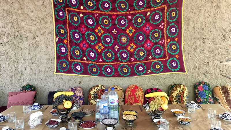 Meals are eaten cross-legged at a colourful dastarkhan - the Uzbek low table.