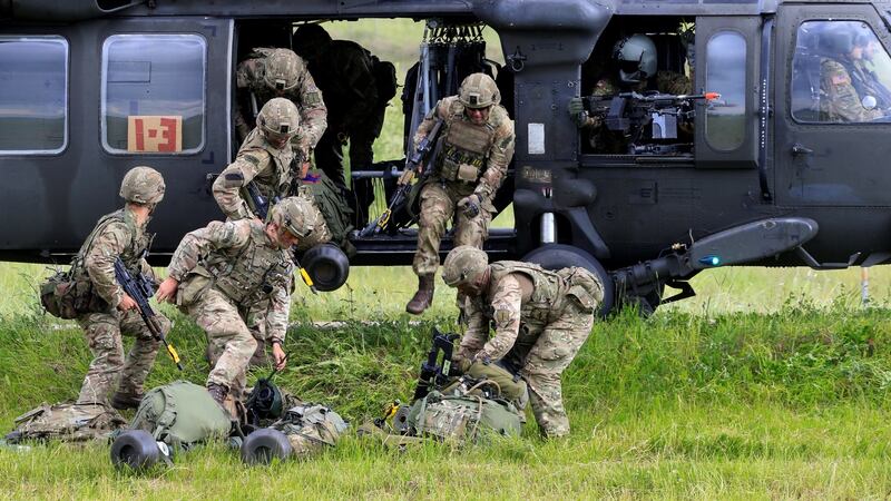 US army soldiers disembark from  Black Hawk helicopter during Suwalki gap defence exercise in Mikyciai, Lithuania. Photograph: Ints Kalnins/Reuters