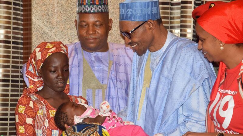 Nigeria president Muhammadu Buhari, second right, receives Amina Ali, the rescued Chibok school girl, at the Presidential palace in Abuja, Nigeria on Thursday. Photograph: AP