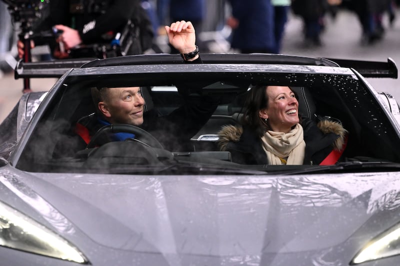 Chris Hoy and partner Sarra Kemp arrive at the stadium. Photograph: Stu Forster/Getty