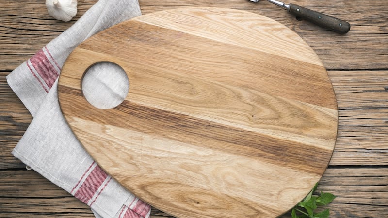 Put a tea towel under the chopping board to stop it from sliding. Photograph: iStock