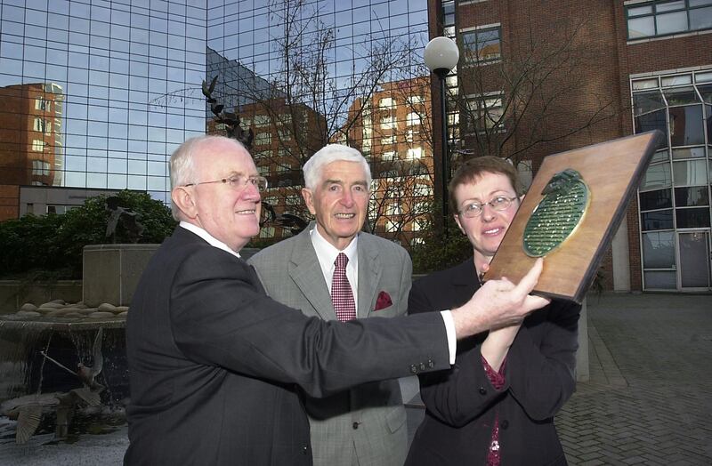 Tom Cavanagh (centre) in 2003 with Pat The Cope Gallagher TD (left), presenting Mary Fitzpatrick, the town clerk of Cavan County Council, with a plaque awarding Cavan first place in the 2003 Anti-Litter League, organised by Cavanagh's group, Irish Business Against Litter.
