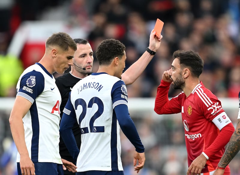 Bruno Fernandes of Manchester United receives a red card from referee Chris Kavanagh during the defeat to Tottenham. Photograph: Michael Regan/Getty