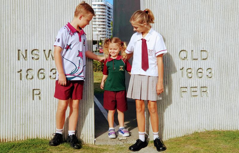 Jess, Emily and Adam Kearney on the border between New South Wales and Queensland. “Crossing the state border through a Covid checkpoint with a signed declaration has become part of our daily routine to get to and from school,” says Anthony Kearney