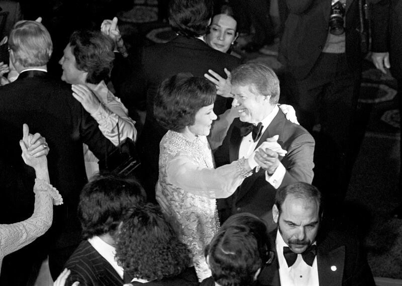 President Jimmy Carter and first lady Rosalynn Carter dance during an inauguration ball in Washington in January 1977. Photograph: Eddie Hausner/The New York Times
                      